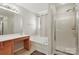 This is a spacious bathroom that includes a soaking tub, vanity, and glass shower, with neutral decor at 3812 Caldwell Ridge Pkwy, Charlotte, NC 28213
