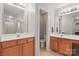 Well-lit bathroom with dual sinks and vanities plus direct access to a separate water closet and shower at 3812 Caldwell Ridge Pkwy, Charlotte, NC 28213
