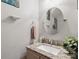 Powder room featuring granite counters, round mirror, neutral walls and decor at 3812 Caldwell Ridge Pkwy, Charlotte, NC 28213