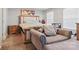 Cozy bedroom with a comfortable bed, neutral decor, and a chaise lounge for reading or relaxing at 3812 Caldwell Ridge Pkwy, Charlotte, NC 28213