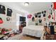 A bright, decorated bedroom features a window, a bed, and ample space for personalization at 3812 Caldwell Ridge Pkwy, Charlotte, NC 28213