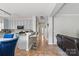 Stylish kitchen with light blue cabinets, granite countertops, stainless steel appliances, and an adjacent breakfast bar at 3812 Caldwell Ridge Pkwy, Charlotte, NC 28213