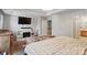 This spacious main bedroom features a fireplace, tv, and en suite bath for relaxation and convenience at 3812 Caldwell Ridge Pkwy, Charlotte, NC 28213