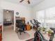 Bedroom with a desk, exercise bike, and a view of the backyard through the window at 3816 Sonoma Way, Monroe, NC 28110
