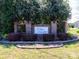 Entrance sign for Hilton Meadow community with brick pillars and manicured landscaping at 3816 Sonoma Way, Monroe, NC 28110