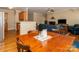 Open concept dining area with hardwood floors adjacent to a comfortable living space at 3816 Sonoma Way, Monroe, NC 28110