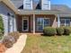 Inviting entrance featuring brick accents, manicured shrubs, and a well-lit walkway to the front door at 3816 Sonoma Way, Monroe, NC 28110