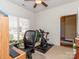 Exercise room featuring a bright window with blinds, carpeted flooring, and exercise equipment at 3816 Sonoma Way, Monroe, NC 28110