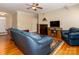 Spacious living area boasting hardwood floors, comfortable furniture, and a cozy fireplace for relaxation at 3816 Sonoma Way, Monroe, NC 28110