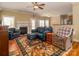 Comfortable living room featuring a fireplace, hardwood floors, and ample natural light through large windows at 3816 Sonoma Way, Monroe, NC 28110