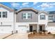 Inviting exterior view of the townhome featuring a one car garage and manicured landscaping at 3870 County Down Ave, Kannapolis, NC 28081