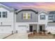 Inviting exterior view of the townhome featuring a one car garage and manicured landscaping at sunset at 3870 County Down Ave, Kannapolis, NC 28081