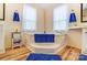 Cozy bathroom features a corner tub with natural light and decor at 405 Briarwood Ct, Mount Holly, NC 28120
