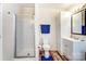 Well-lit bathroom features a shower, vanity, and linen closet at 405 Briarwood Ct, Mount Holly, NC 28120