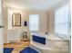 Bright bathroom with corner tub, stylish vanity, and natural light at 405 Briarwood Ct, Mount Holly, NC 28120