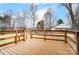 A spacious wooden deck overlooks the backyard and home, perfect for outdoor relaxation at 405 Briarwood Ct, Mount Holly, NC 28120