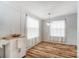 Cozy dining room featuring natural light, wood floors and a modern chandelier at 405 Briarwood Ct, Mount Holly, NC 28120