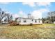 Exterior view showing home, carport, and deck at 405 Briarwood Ct, Mount Holly, NC 28120