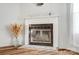 Close-up of a charming fireplace with white mantle and decorative accents adds warmth and character to the living space at 405 Briarwood Ct, Mount Holly, NC 28120