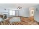 Bright, open-concept living room with modern floors, fireplace, and ample natural light offers a welcoming space at 405 Briarwood Ct, Mount Holly, NC 28120
