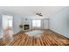 Spacious living room features wood floors, fireplace, and ample natural light, creating a comfortable and inviting atmosphere at 405 Briarwood Ct, Mount Holly, NC 28120