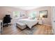 Bright bedroom with hardwood floors, desk, and comfortable decorative throw pillows at 41 Selma Dr, Mooresville, NC 28115