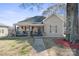 Charming single-story home with a welcoming front porch and cozy curb appeal with colorful decor at 41 Selma Dr, Mooresville, NC 28115