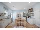 Well-lit kitchen featuring white cabinets, stainless steel appliances, and stylish decor at 41 Selma Dr, Mooresville, NC 28115