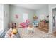Spacious playroom with lots of light, playroom furniture, and neutral colored carpet for flexible usage at 41 Selma Dr, Mooresville, NC 28115
