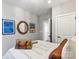 Cozy bedroom with a striped comforter, sports-themed decorations, and warm, neutral tones at 411 Sunharvest Ln, Indian Trail, NC 28079