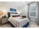 Modern bedroom design with a bed, side table, and a window for plenty of natural light at 411 Sunharvest Ln, Indian Trail, NC 28079