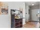 Inviting foyer features an ornate bar and warm wood floors, creating a welcoming atmosphere at 411 Sunharvest Ln, Indian Trail, NC 28079