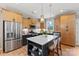 Modern kitchen featuring a central island with a white countertop and stylish pendant lighting at 411 Sunharvest Ln, Indian Trail, NC 28079