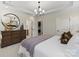 Serene primary bedroom boasts a decorative dresser, a stylish mirror, and plenty of storage at 411 Sunharvest Ln, Indian Trail, NC 28079