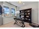 Inviting home office featuring a bookshelf, large windows, a modern desk, and views of the outdoors at 411 Sunharvest Ln, Indian Trail, NC 28079