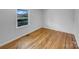 Bright bedroom with hardwood floors, neutral paint, and ample natural light from a window at 475 Union Baptist Church Rd, York, SC 29745