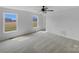 Spacious bedroom with neutral carpeting, a ceiling fan and natural light from two windows at 475 Union Baptist Church Rd, York, SC 29745
