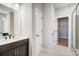 Modern bathroom featuring dark cabinets, white countertops, double sinks, and a glass shower at 522 Fern Hill Rd # 17, Mooresville, NC 28117