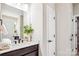 The bathroom features a sleek vanity with modern fixtures and a decorative plant at 522 Fern Hill Rd # 17, Mooresville, NC 28117