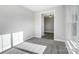 A light-filled bedroom with neutral walls and gray carpeting at 522 Fern Hill Rd # 17, Mooresville, NC 28117