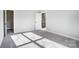 Bedroom showcasing lots of natural light from an open door to the landing and an open closet with a shelf at 522 Fern Hill Rd # 17, Mooresville, NC 28117