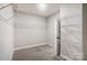 Spacious walk-in closet with carpeted floor, wire shelving, and ample storage space at 522 Fern Hill Rd # 17, Mooresville, NC 28117