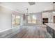 Bright dining area with hardwood floors, large windows, and sliding doors to outdoor space at 522 Fern Hill Rd # 17, Mooresville, NC 28117