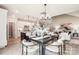 Open dining and kitchen area, featuring stylish furniture and lighting for a welcoming entertaining space at 522 Fern Hill Rd # 17, Mooresville, NC 28117