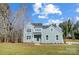 Two-story home with light blue siding, black front door, white framed windows, and a freshly mowed lawn at 522 Fern Hill Rd # 17, Mooresville, NC 28117