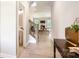 Inviting hallway leading to the living area, features a half bath and staircase at 522 Fern Hill Rd # 17, Mooresville, NC 28117
