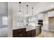 Kitchen with large island, stainless steel appliances, and view to the backyard at 522 Fern Hill Rd # 17, Mooresville, NC 28117