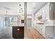 Bright, open kitchen with an island, gas cooktop, pendant lights, and white cabinetry at 522 Fern Hill Rd # 17, Mooresville, NC 28117