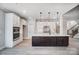 Spacious kitchen island with dark wood cabinets, white countertops, and stainless steel appliances at 522 Fern Hill Rd # 17, Mooresville, NC 28117