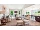 Cozy living room featuring a fireplace, large windows, and comfortable seating, perfect for relaxation and gatherings at 522 Fern Hill Rd # 17, Mooresville, NC 28117